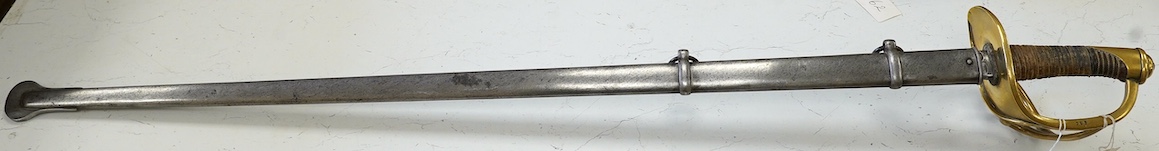 An 1854 French Curassier’s heavy cavalry trooper’s back sword with double fullered blade in its steel scabbard, blade 98cm. Condition - good